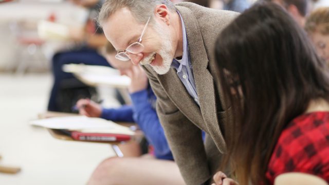 Professor assisting student