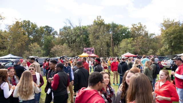 Students and fans tailgate before a football game