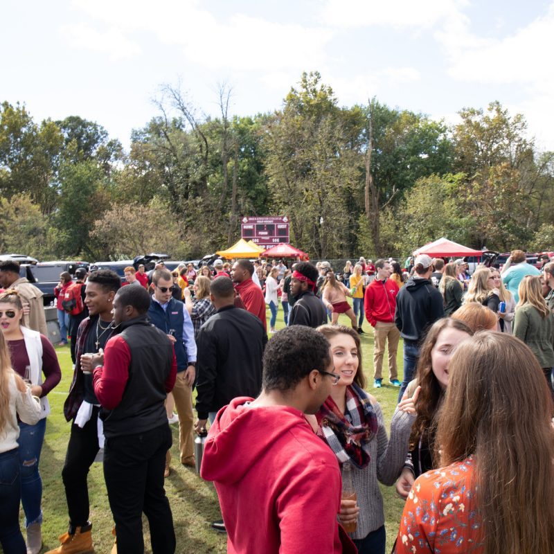 Students and fans tailgate before a football game