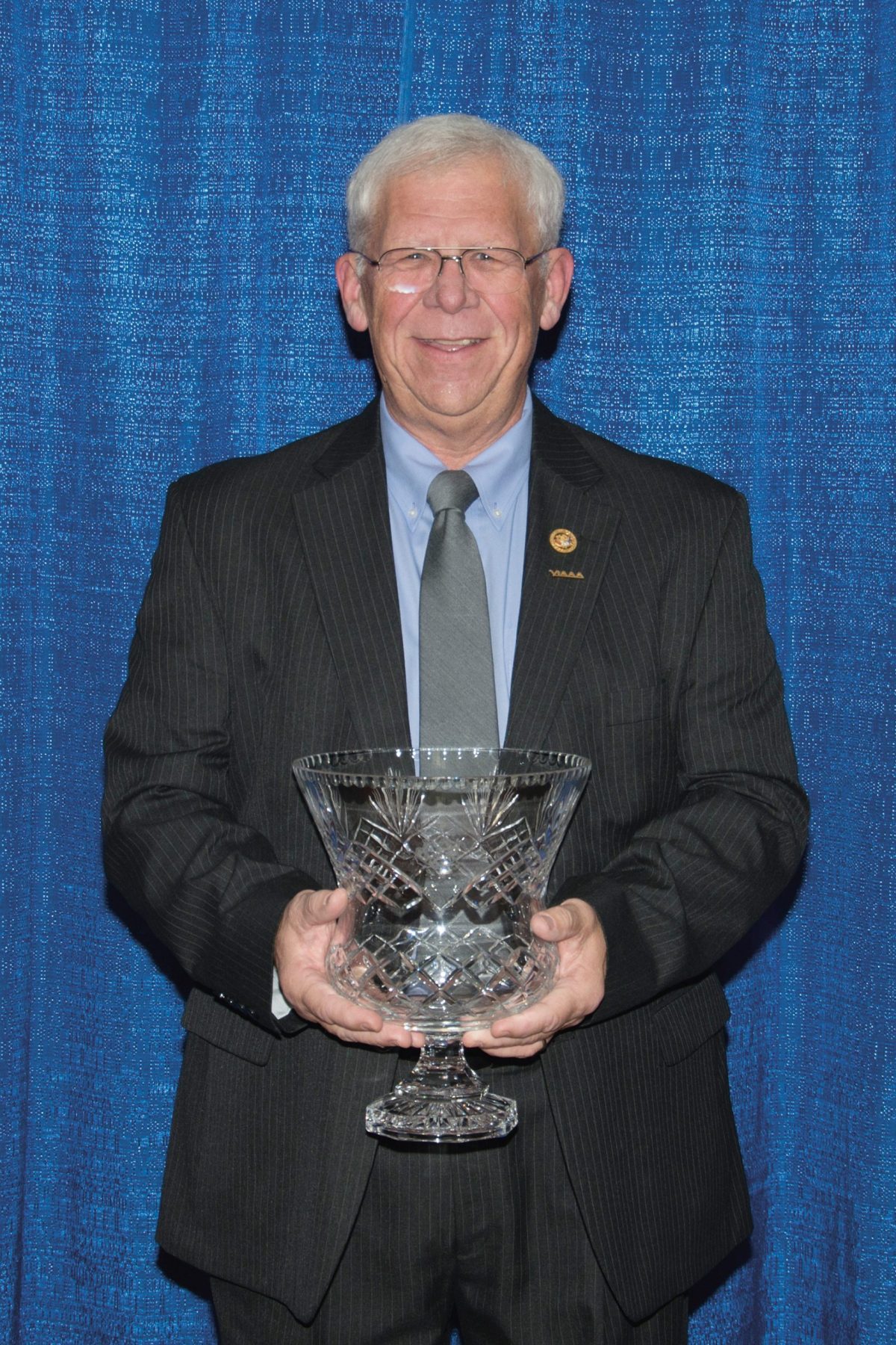 Man holding an award