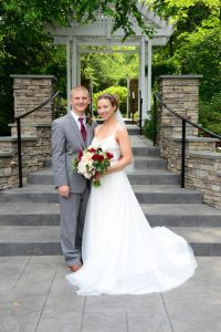 A groom and bride stand next to each other