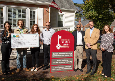 Group photo posing with check from Think Green Grant from Waste Management