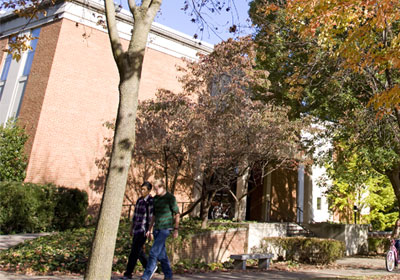 Two people walk in from of the Alexander Mack Memorial Library