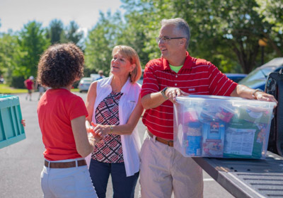 President Bushman and his wife talking to a parent