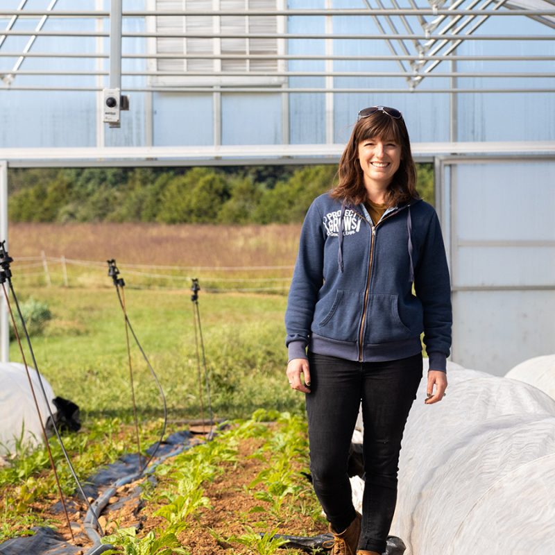 Clara Metzler walking in a greenhouse