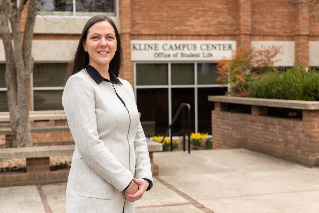 Portrait of Manuela Gabriel with Kline Campus Center blurred in the background