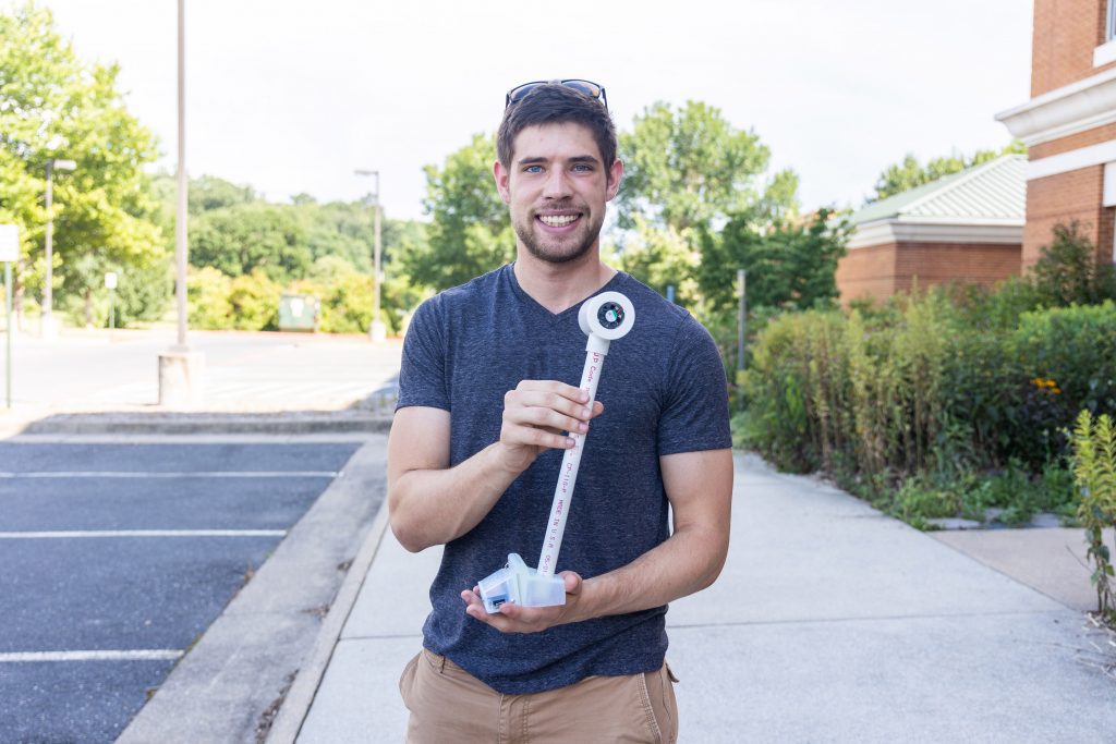 Trevor Brooks holds a Heat Watch sensor