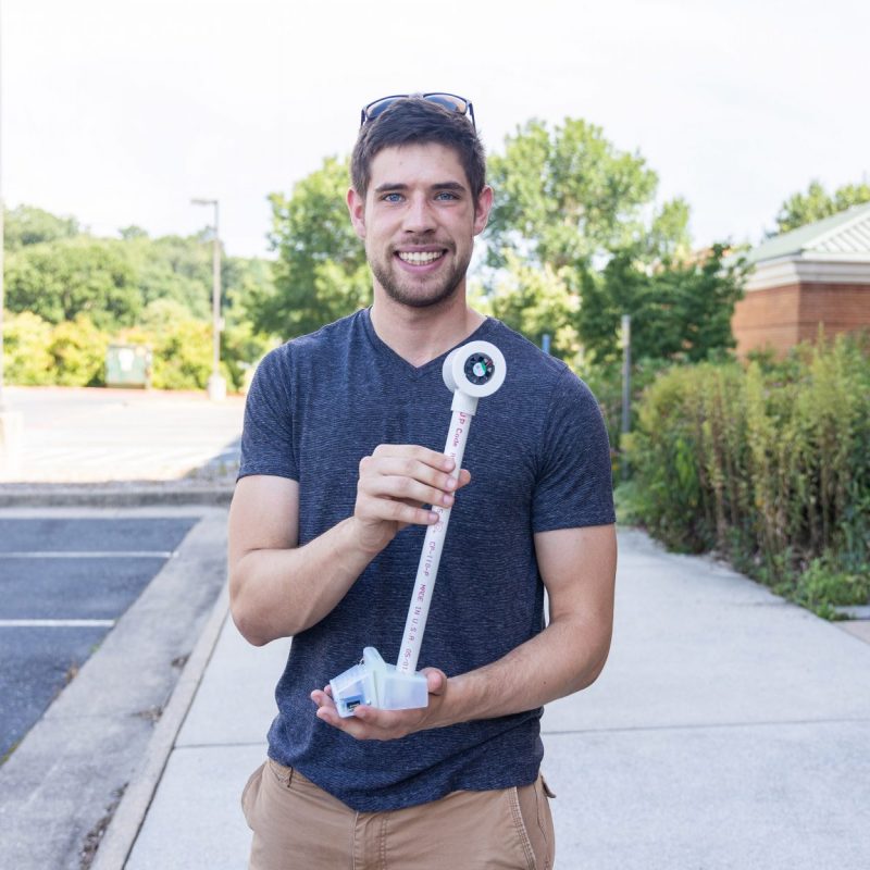 Trevor Brooks holds a Heat Watch sensor