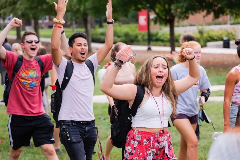 Students cheer during a welcome week activities