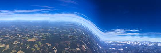 Blue and white streaks that look like an abstract airplace in the sky