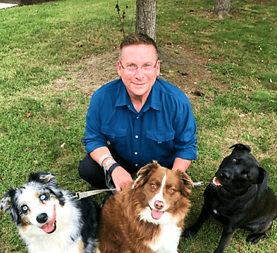 Officer Zander with his dogs Milo, Penny and Rosie