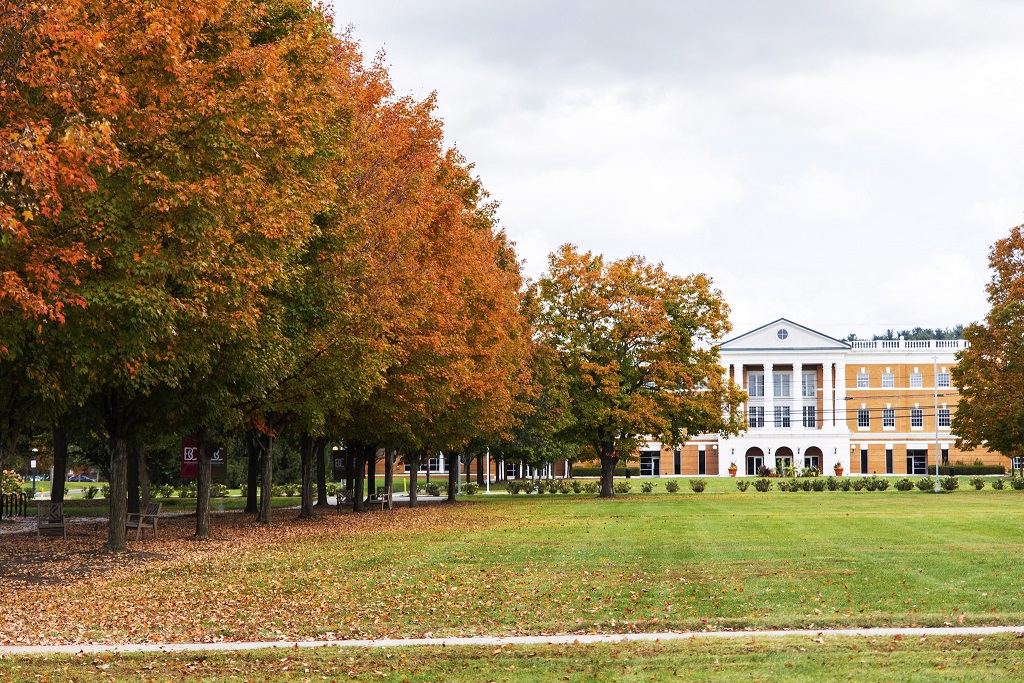 Trees with orange and red leaves line Bridgewater College's campus