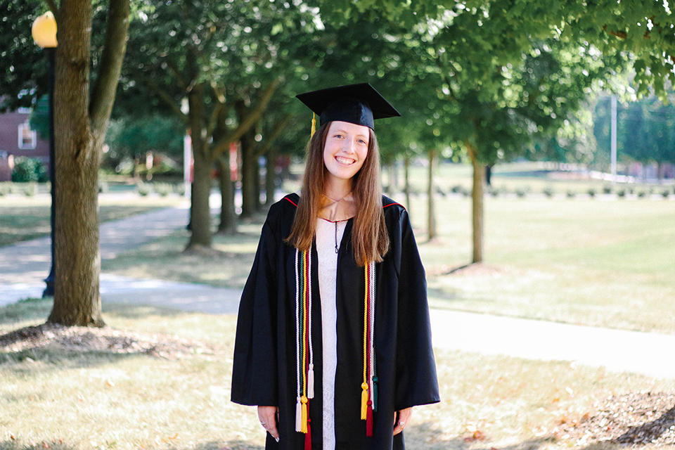 Sarah Riley wearing a graduation cap and gown