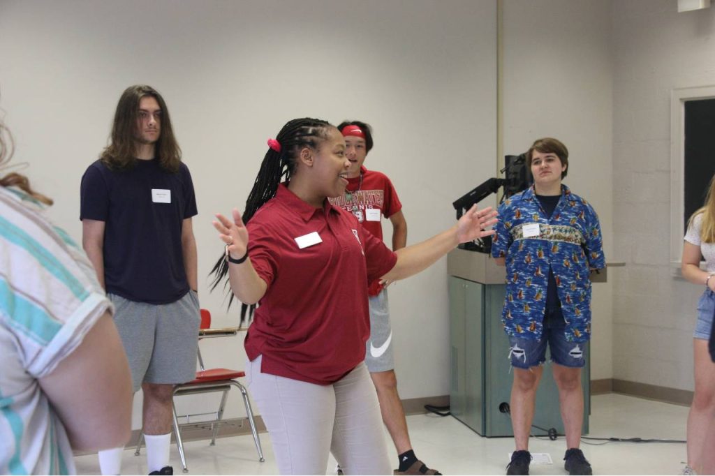 Soar Mentor talking to group of students inside