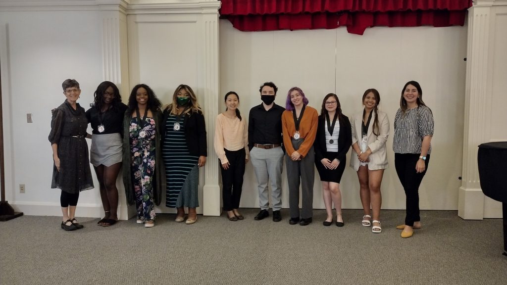 A row of students and staff pictured smiling