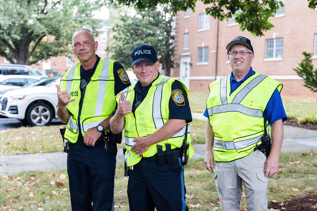 Campus Police Officer John Painter, Campus Police Officer Kelly Zander and Campus Safety Officer Kevin Lam at move-in day for student-athletes in August 2021