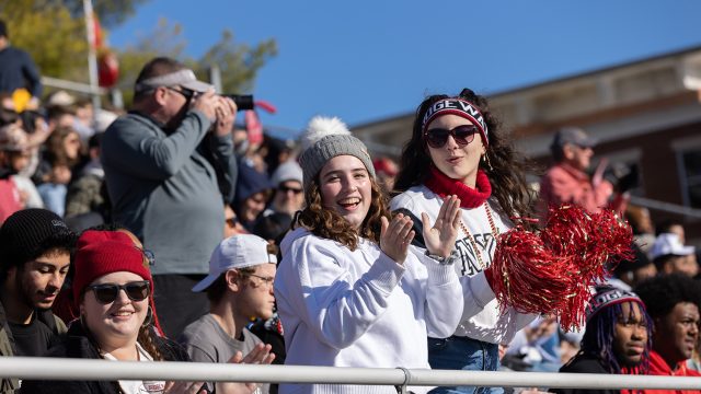 Bridgewater College football fans cheering at the football game