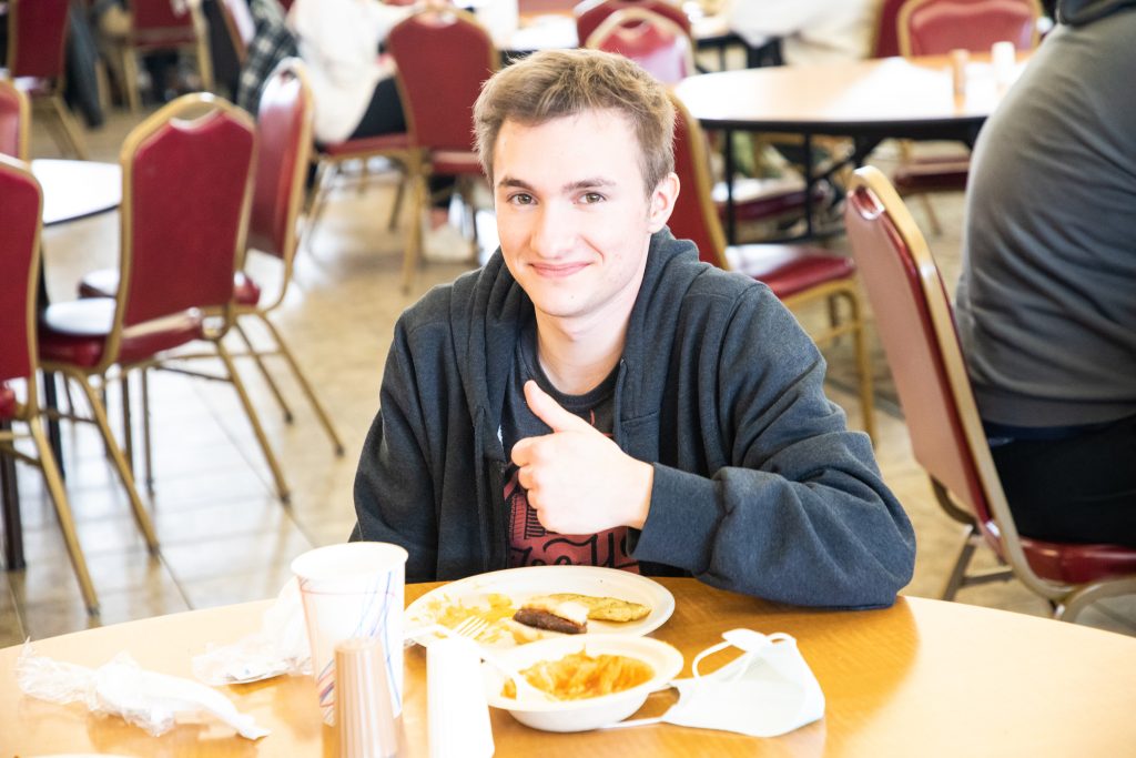 Student giving thumbs up