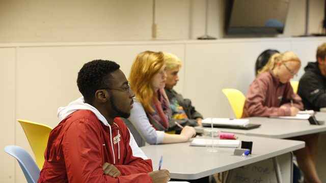 Students sitting in classroom taking notes