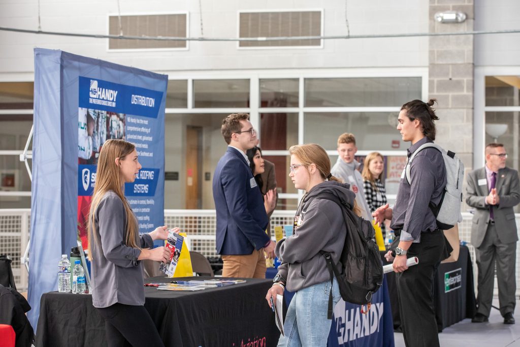 Students and employers interacting at career exploration day 