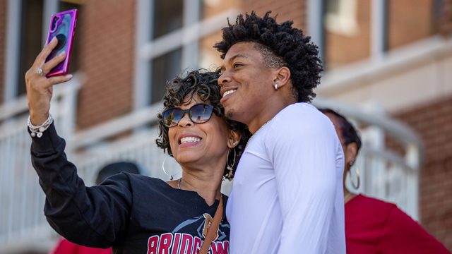 Man and woman smiling for a selfie