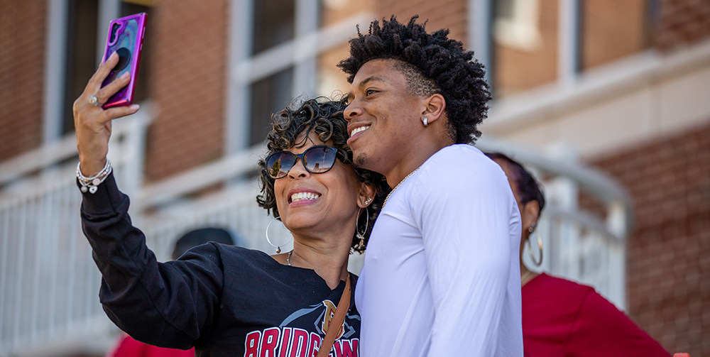 Man and woman smiling for a selfie