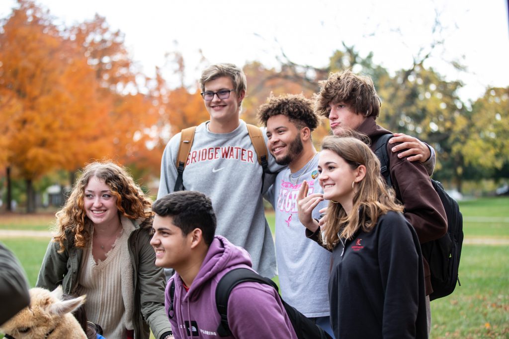 Group of students posing for photo all smiling