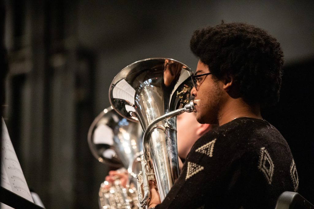 Student playing the tuba