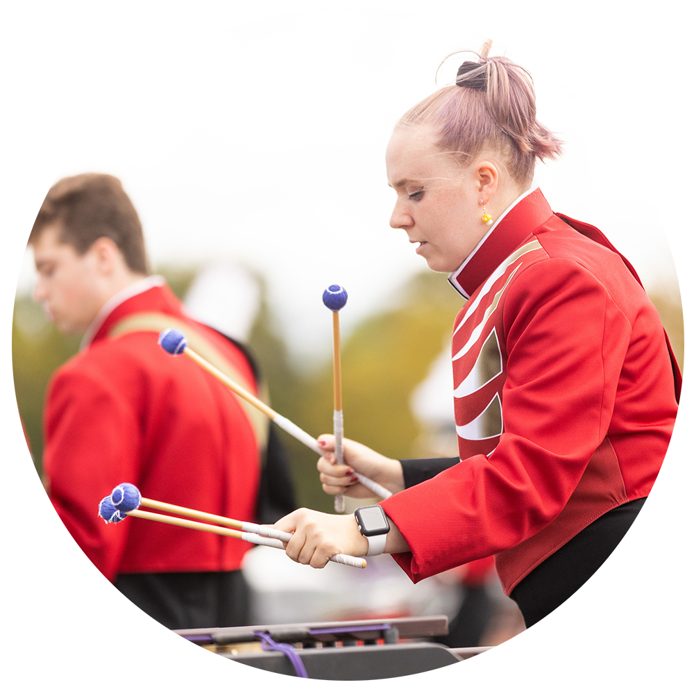 Member of marching band playing the xylophone