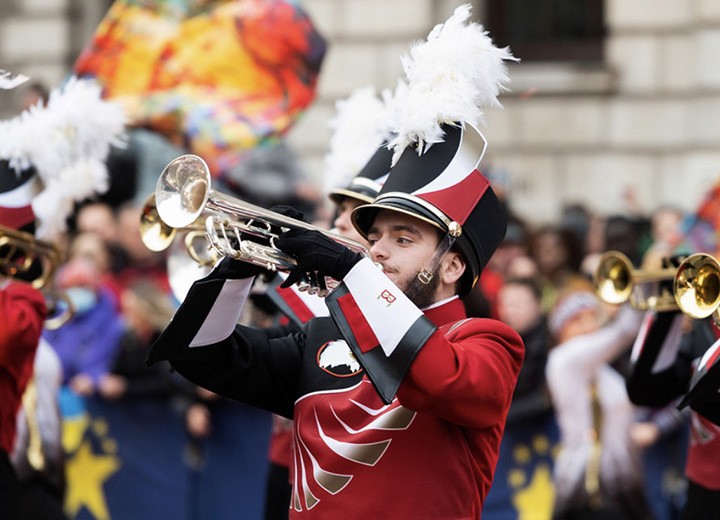 A member of the Screamin' Eagles Marching Band playing the trumpet during the parade in London
