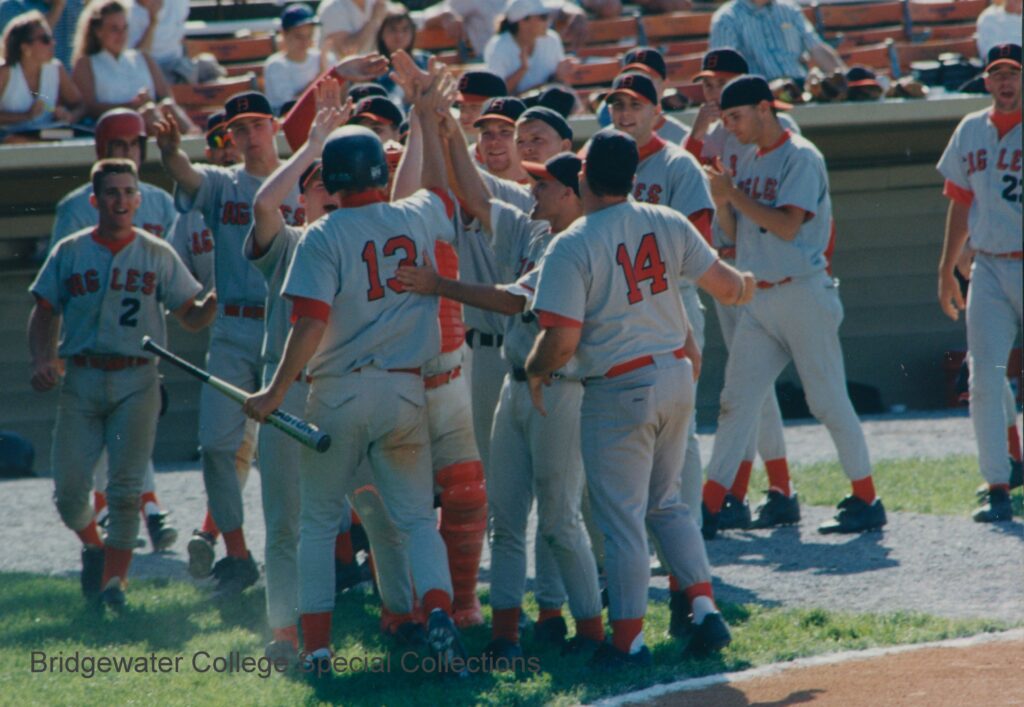 Baseball players celebrating in a huddle