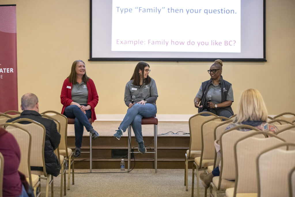 Three women on the parents panel speaking to a group 