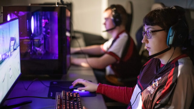 Students playing in esports arena