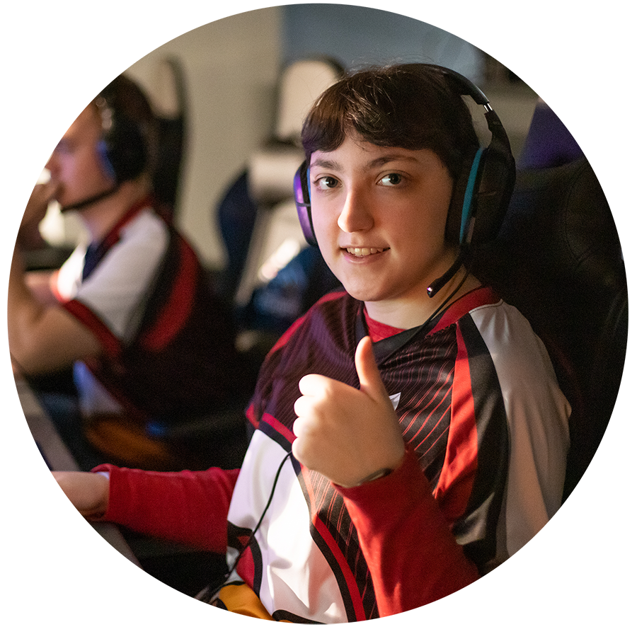 Woman in esports uniform wearing headphone giving a thumbs up