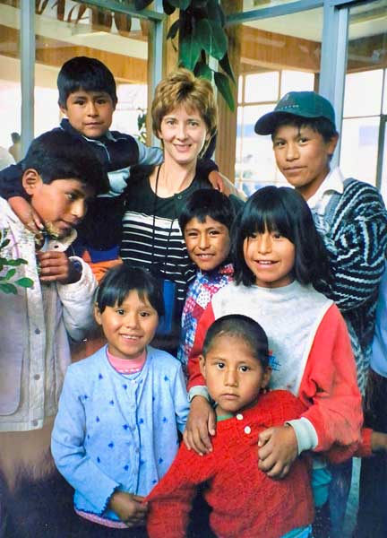 Suzie Fike with children from the Shalom Es Mi Casa home