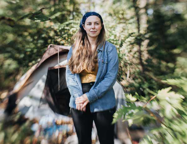 Allison Henry stands in front of a tent city in Waynesboro VA