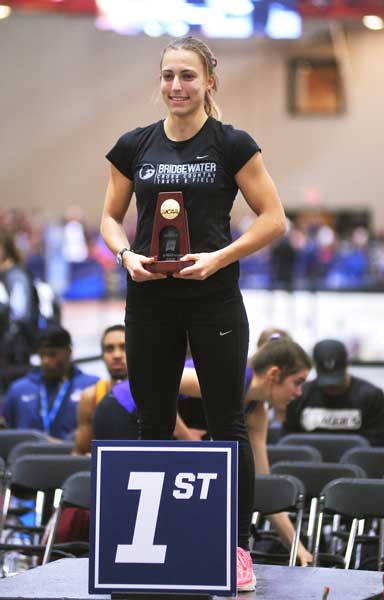 Amber Celen holds the national champion trophy.