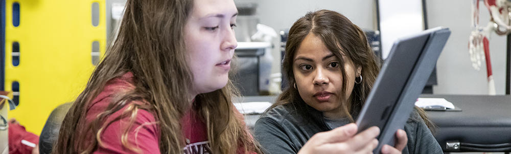 Student looking at iPad in athletic training class