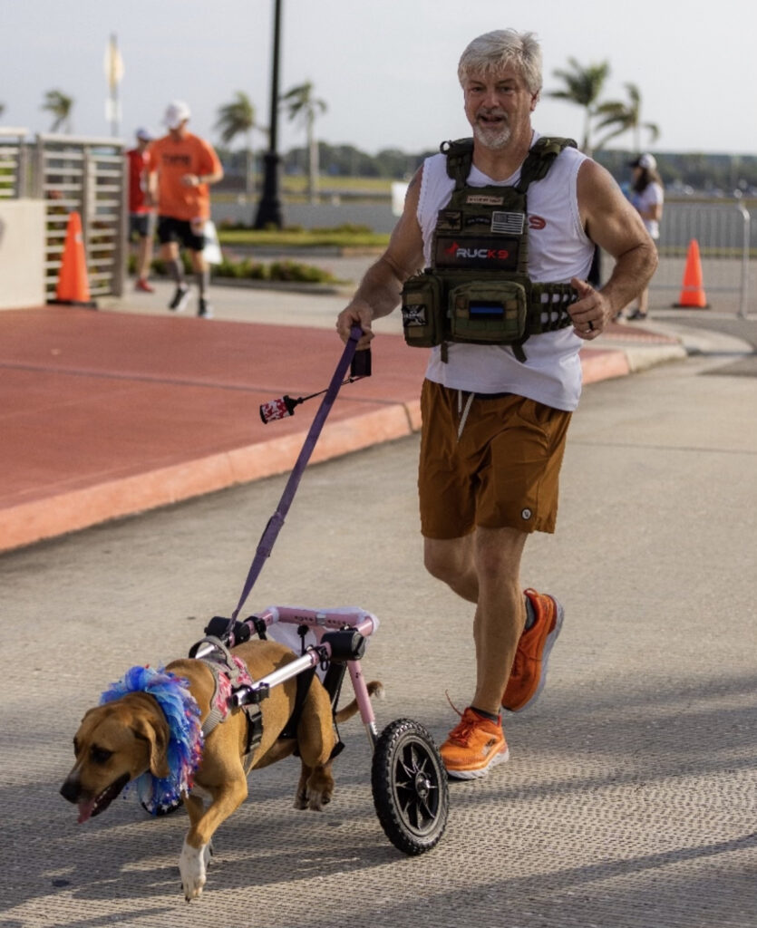 John Cox runs a race with Mattie May, a hound mix