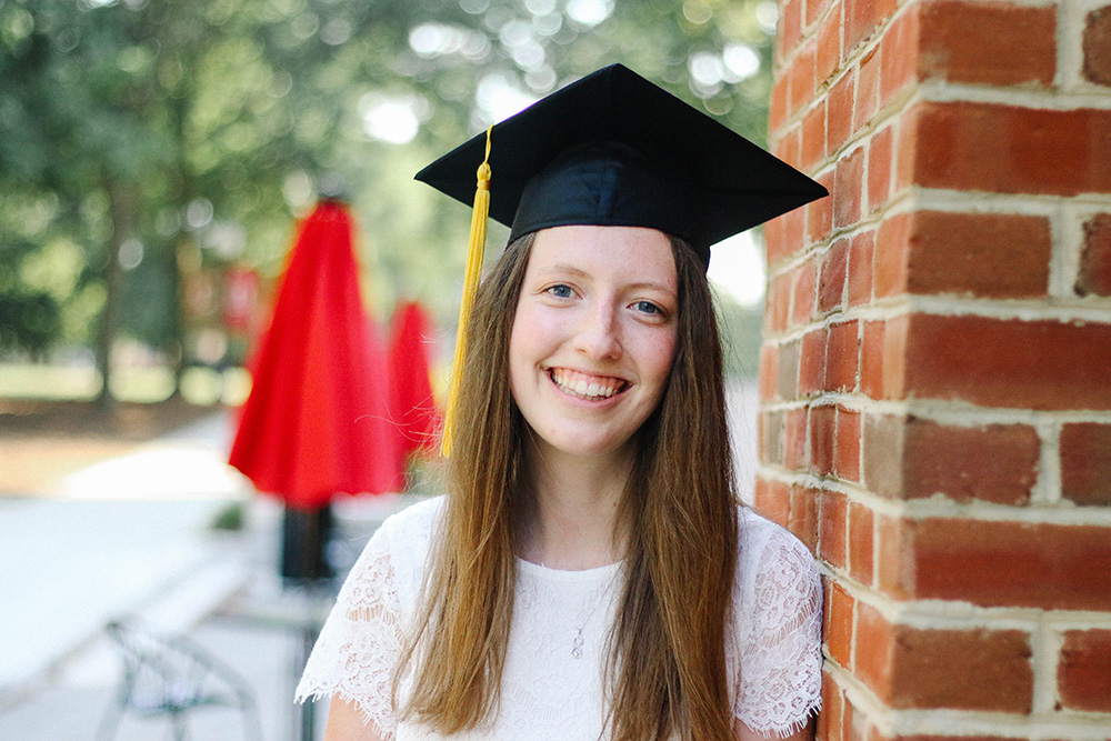 Sarah Riley wearing a graduation cap
