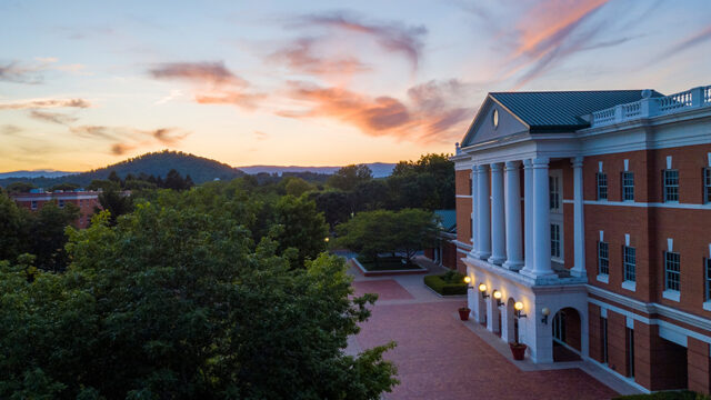 Colorful sunset on campus behind McKinney Hall