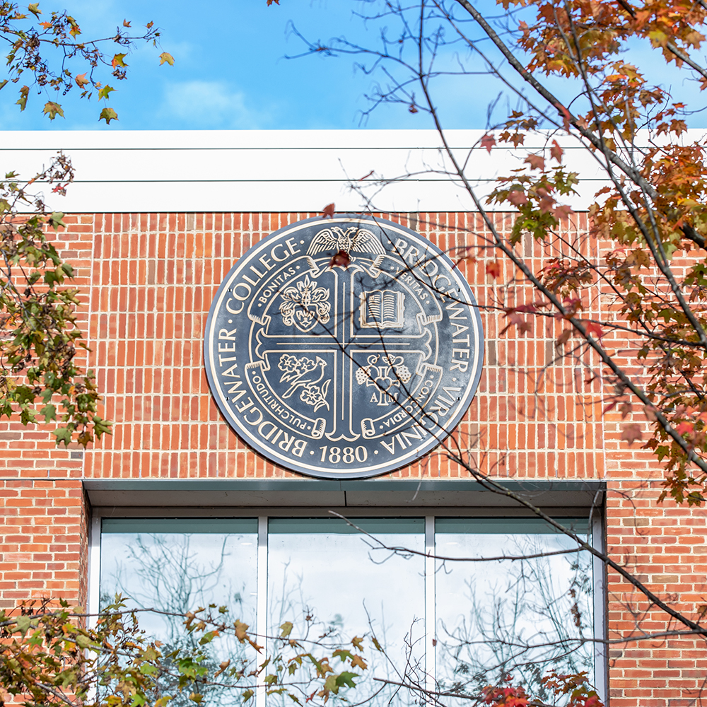 Bridgewater College seal on brick building