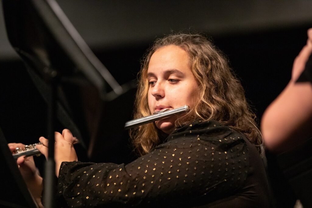 A woman playing the flute