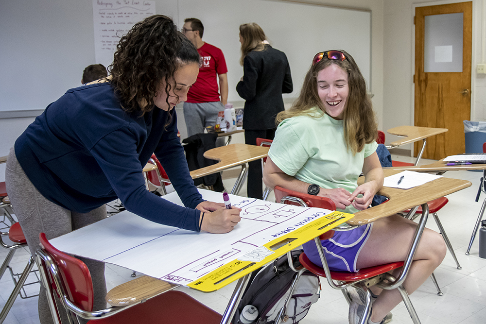 Students working together in human resources class