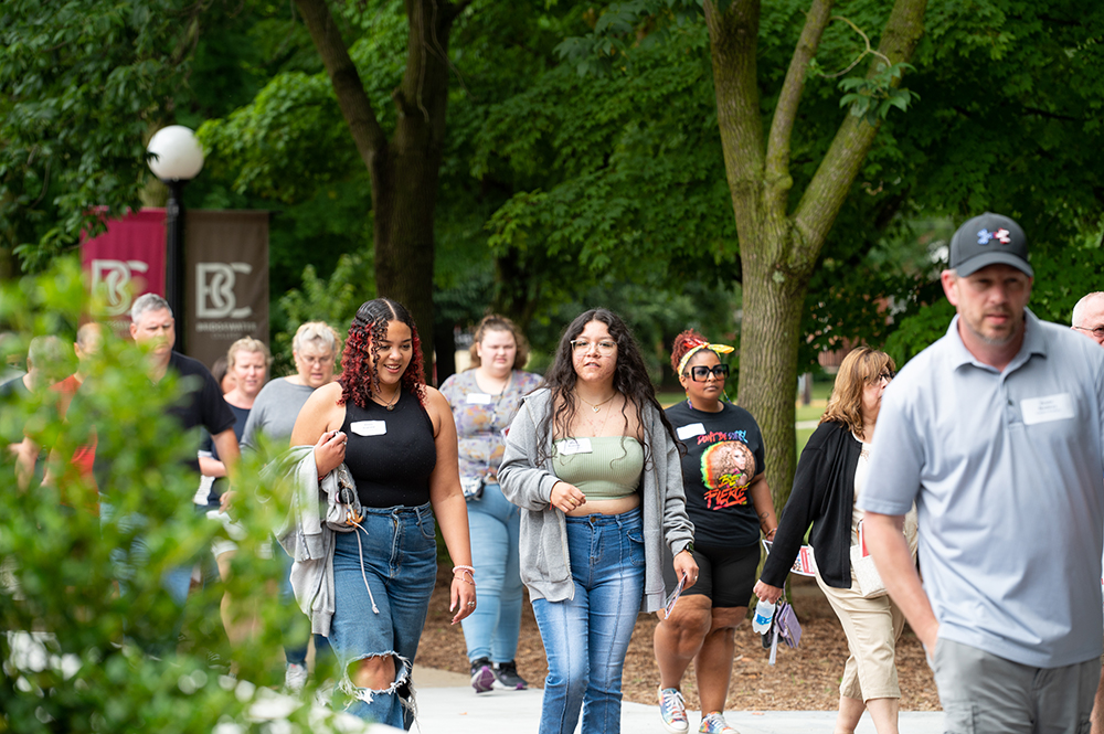 Group of people walking on campus