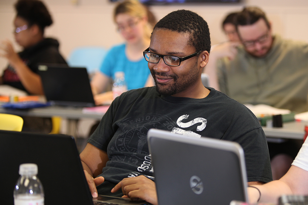 Student sitting at laptop during class