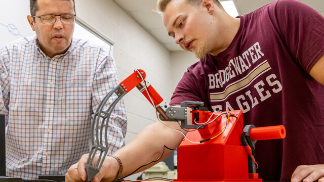 Professor and student working on an engineering project