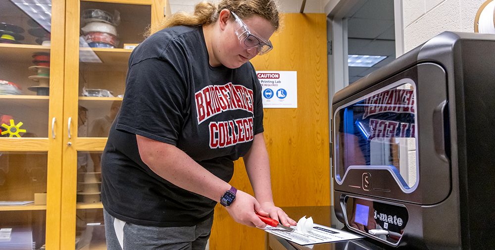 Student in engineering class working with a 3-D printed object