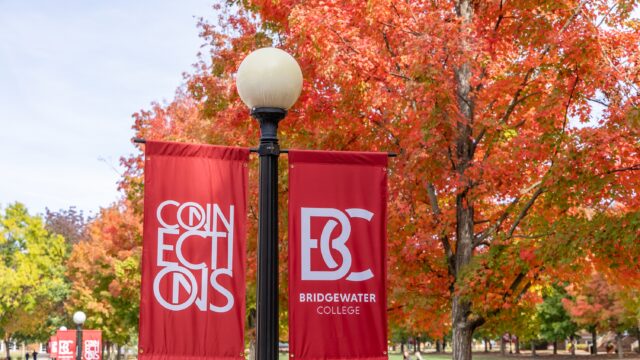 red banners that read B-C Bridgewater College and Connections. A fall tree is behind the banners
