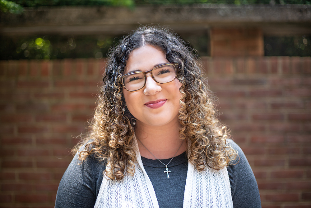 Portrait of Stephanie Kauffman with brick background